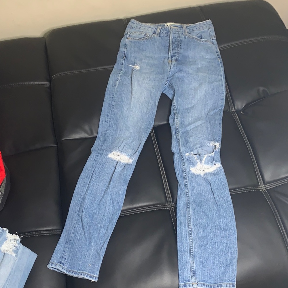 Light blue denim distressed jeans in a size 2.